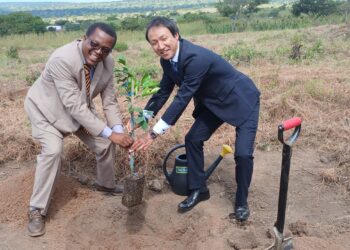Lungelo Nhlengetfwa and Counsellor Andoi Kei sign the grant agreement for the Agriculture Laboratory at Mhlumeni High School.