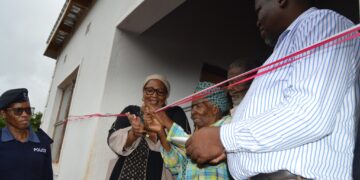 Deputy Prime Minister Thulisile Dladla hands over keys to a new home during her visit to the Hhohho region.