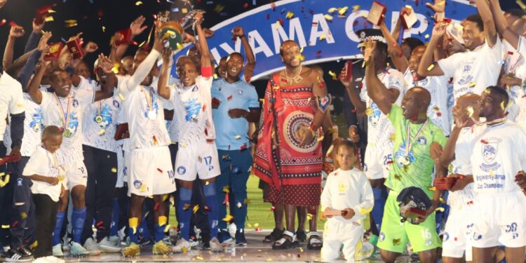 His Majesty King Mswati III presents trophies to the 2025 Ingwenyama Cup champions during a vibrant ceremony at Somhlolo National Stadium.