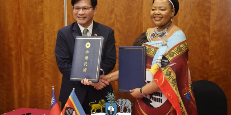 Eswatini and Taiwan officials shake hands after signing a pact to combat disinformation.