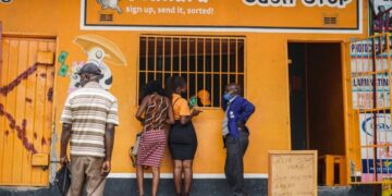 Customers queue at a Mukuru cash collection point