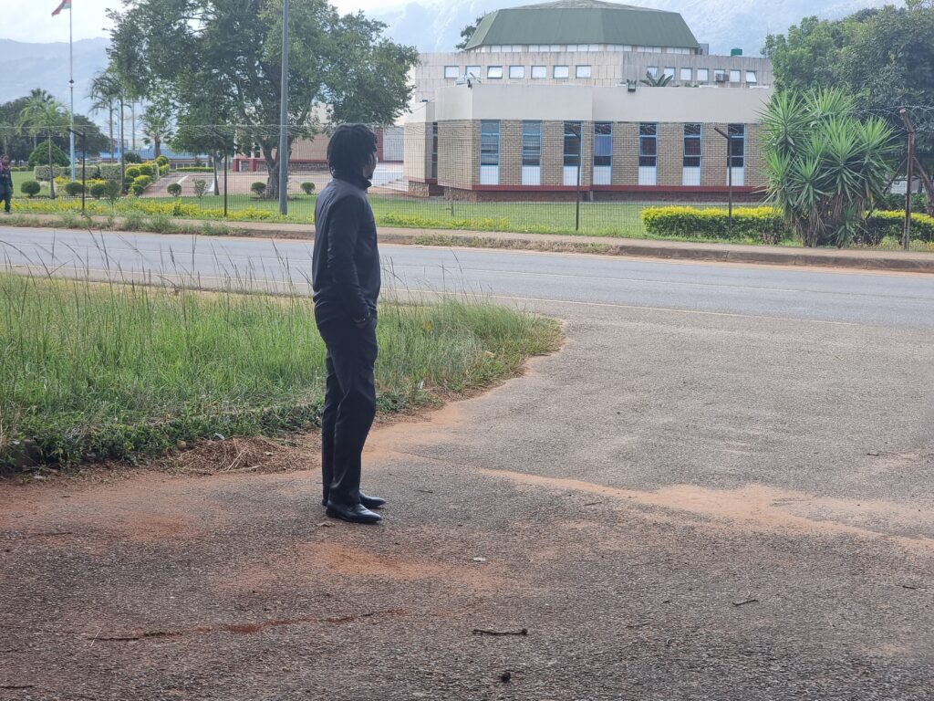 Adekunle Owolabi gazes at the Parliament of the Kingdom of Eswatini on Parliament Road, Lobamba — next to Nkhanini Offices and opposite the Museum.
Photo: Sibusiso Mbele