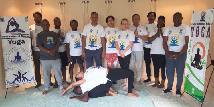 The High Commissioner of India to Eswatini joins participants in a group photo ahead of the public yoga session.Photo © High Commission of India – Mbabane