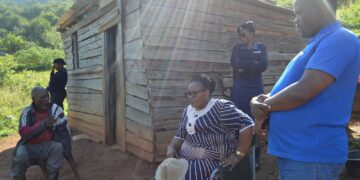 Deputy Prime Minister Thulisile Dladla and Minister Sikhumbuzo Dlamini assess the condition of Mkhulu Magele Shabangu’s collapsing wooden house in Nkwene.