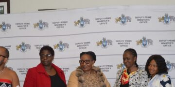 Deputy Prime Minister Thulisile Dladla receives boxes of reading glasses from Community Connections board member Cindy Shabangu during a handover ceremony at the DPM’s Office.
