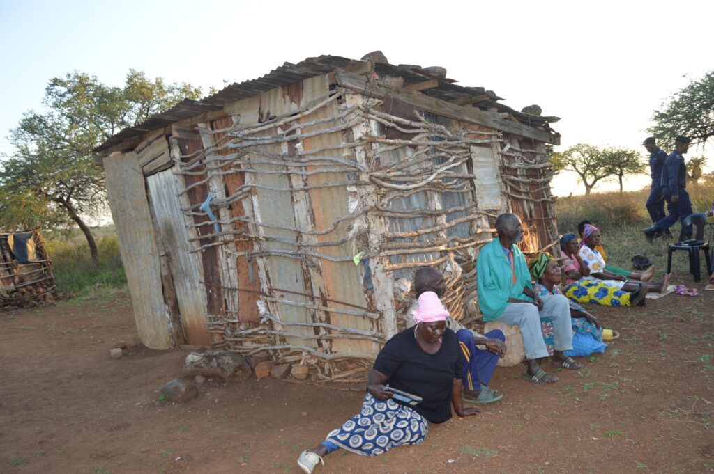 Deputy Prime Minister Thulisile Dladla inspects a dilapidated homestead in Mpolonjeni Inkhundla during a visit to assess housing needs among vulnerable families.