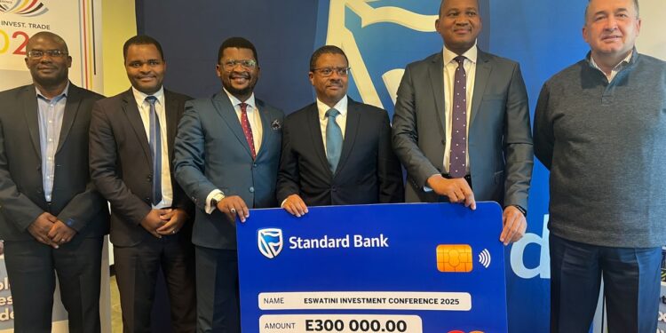 Standard Bank Eswatini Chief Executive Mvuselelo Fakudze (right) hands over a E300,000 sponsorship cheque to EIPA CEO Sibani Mngomezulu (left) during a ceremony marking the bank’s support for the upcoming Eswatini Investment Conference.