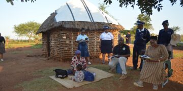 Deputy Prime Minister Thulisile Dladla inspects a dilapidated homestead in Mpolonjeni Inkhundla during a visit to assess housing needs among vulnerable families.