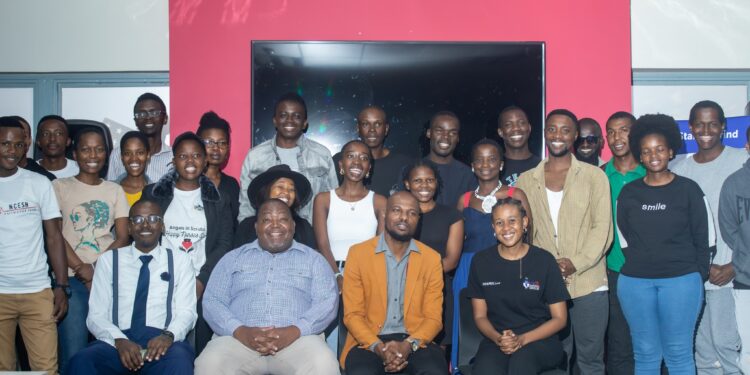 Participants and speakers, including SEDCO’s Bhekani Dlamini, pose for a group photo after the Startup Grind Manzini panel discussion at the American Corner, Manzini Library.