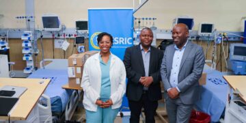 Eswatini Royal Insurance Corporation (ESRIC) General Manager Zama Ngcobo hands over vital ICU equipment to Dr Thandolwethu Tembe of Mbabane Government Hospital.