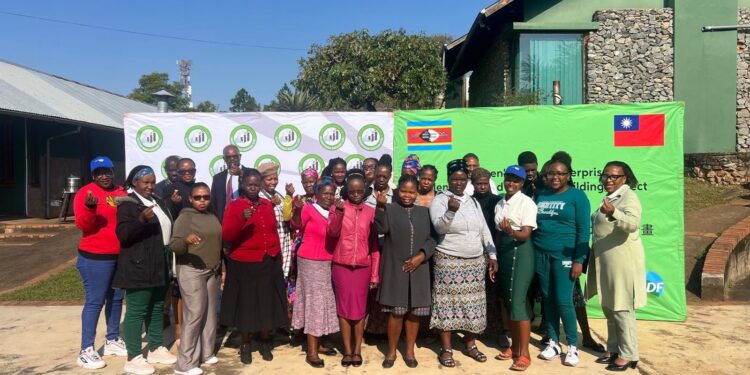 Participants of the Women’s Microenterprise Project share their experiences from international exhibitions during a session at Mananga Business Centre.