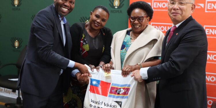 Deputy Prime Minister Thulisile Dladla receives a symbolic bag of rice during the launch of the national food assistance programme at the NDMA Warehouse in Matsapha, following a 2,000-ton donation from the Republic of China (Taiwan). Photo: NDMA