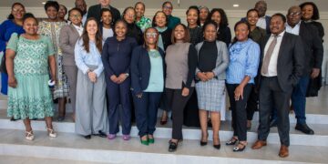 Representatives from the Central Bank of Eswatini, Ministry of Finance, FSRA, and CFI pose for a group photo after a financial inclusion session in Mbabane. Dr. Alfred Hannig, CEO of the Alliance for Financial Inclusion, is seen standing at the back. Photo: Central Bank Eswatini
