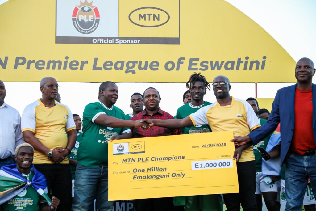 MTN Eswatini CEO hands over the championship cheque to Nsingizini Hotspurs following their historic Premier League triumph. Photo by MTN Eswatini