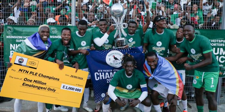 Nsingizini Hotspurs players and technical team celebrate after securing their first-ever MTN Premier League title with a resounding 5-0 win over Sidvwashini United. Photo by MTN Eswatini