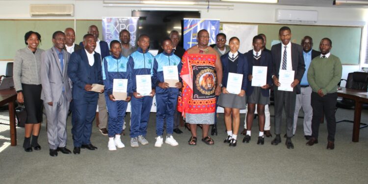 Minister of Labour and Social Security Phila Buthelezi joins students and teachers from Lamawandla and Mkhuzweni High Schools for a group photo after celebrating their top placements at the 2024 Aqualibrium Water Competition in South Africa.