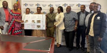Deputy Prime Minister Thulisile Dladla receives the approved house design for Mlulamli Dlamini from Eswatini Contractors Association Chairperson Rueben Msibi during a briefing at the DPM’s Office.