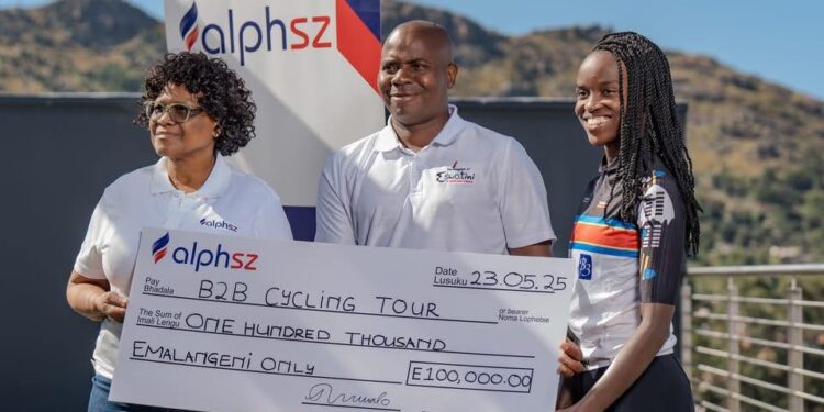 AlphSZ CEO Thandile Nxumalo presents a symbolic cheque of E100 000 in support of the Border to Border Cycle Tour, joined by event partners and tourism officials in Mbabane.