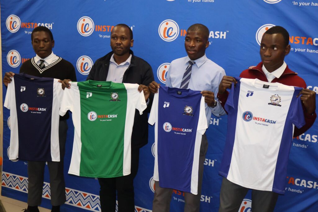 Officials and school representatives pose for a group photo after the Instacash Schools Soccer Tournament Top 16 draw at Sigwaca House in Mbabane.
