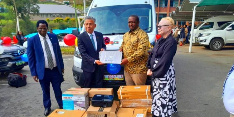 Officials from the Ministry of Labour and Social Security receive a specialised vehicle from the Taiwan Embassy for the Vocational, Training and Rehabilitation Services Unit.