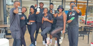 Gcinisizwe “Nurse WeKhantri” Buthelezi (left), founder of Drip Miles Running Club, leads the team during their inaugural 5km run.