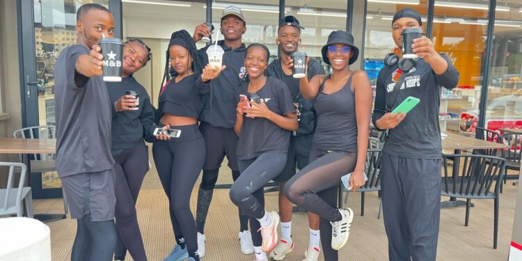 Gcinisizwe “Nurse WeKhantri” Buthelezi (left), founder of Drip Miles Running Club, leads the team during their inaugural 5km run.