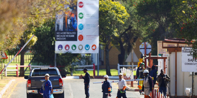 Mine workers walk after being rescued from underground at the Sibanye Stillwater mine in Westonaria, near Johannesburg, South Africa, May 23, 2025. They were trapped underground at one of the shafts at the Kloof gold mine. REUTERS/Siphiwe Sibeko