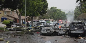 Several cars ignited after a small plane crashed into a San Diego neighborhood early Thursday. Gregory Bull/AP