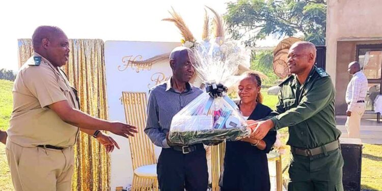 Retiring officers honored: Big Bend Correctional staff present gifts to Assistant Chief Officer Ernest Dlamini and Sergeants Jeremiah Maziya and Mbuyazwe Gina during a farewell event held at the facility.
