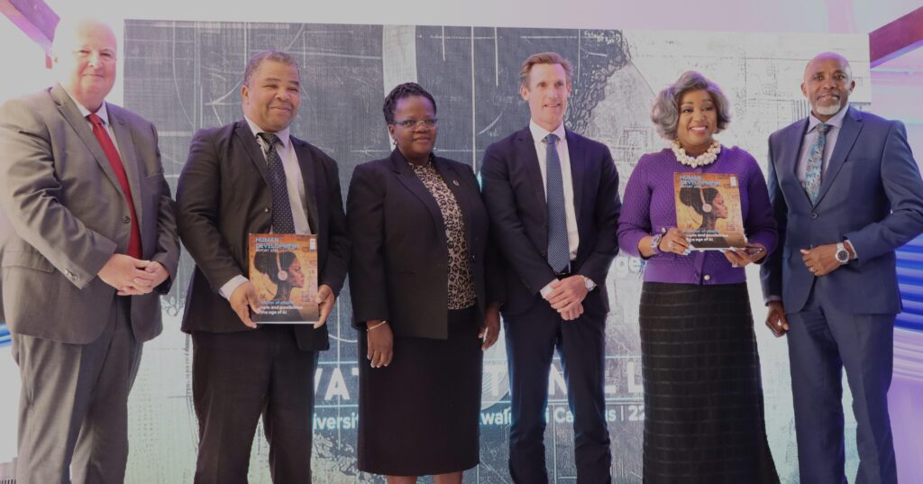 UNDP Resident Representative, Mr. Henrik Franklin, poses with dignitaries after the national launch of the 2025 Human Development Report. UNDP/Thoba Dlamini