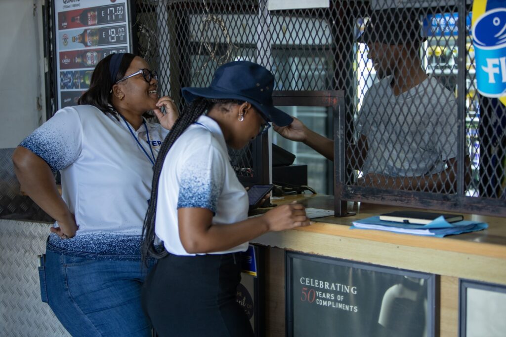 Eswatini Revenue Service (ERS) officials attends to a small business owner during the Bafundzise tax education campaign