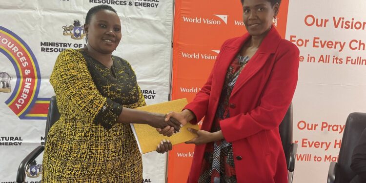 Lindiwe Mbingo of the Ministry of Natural Resources and Energy and Tinah Mukunda of World Vision Eswatini sign an MoU in Mbabane, sealing a partnership to bring clean water to 18 constituencies by 2030.