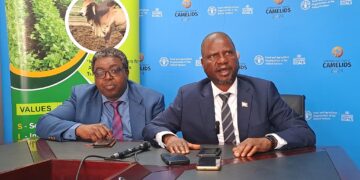 Minister of Agriculture with the ministry’s Press Secretary during the launch of FAO-supported agriculture programmes.