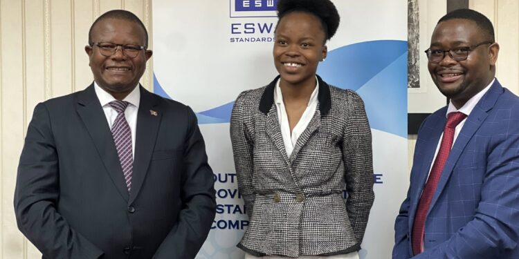 Vuyelwa Simelane receives a congratulatory token of E10,000 from Minister Mancoba Khumalo at the Ministry of Commerce after securing a top-three spot in the ARSO Continental Essay Competition.