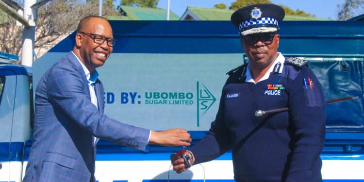 National Commissioner of Police Manoma Vusie Masango receives vehicle keys from Ubombo Sugar Director Muzi Siyaya during the official handover ceremony in Lubombo.