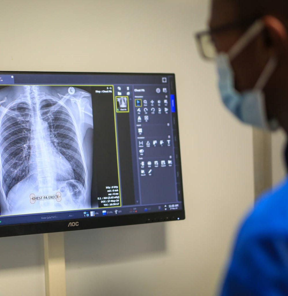 A physician reviews scan results