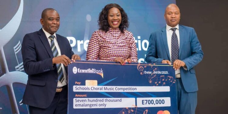 Eswatini Bank Managing Director, Dr. Nozizwe Mulela, presents a symbolic cheque of E700,000 during the launch of the 20th Schools Choral Music Competition at Happy Valley Hotel.