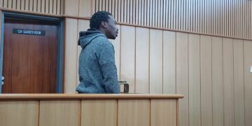 Chakaza Dlamini standing in the accused dock at the Mbabane Magistrates Court, where he faces charges for allegedly assaulting his nephew with a pool stick. Photo by Lindelwa Myeni