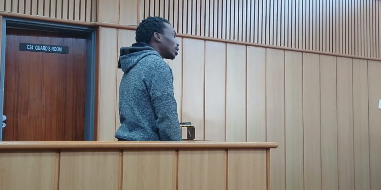 Chakaza Dlamini standing in the accused dock at the Mbabane Magistrates Court, where he faces charges for allegedly assaulting his nephew with a pool stick. Photo by Lindelwa Myeni