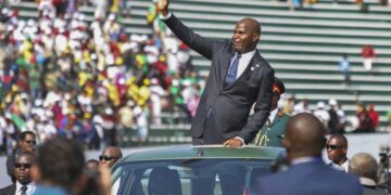 President Daniel Chapo waves to the crowd at the National Independence Stadium during Mozambique’s 50th independence celebrations, as citizens and regional leaders gather to mark the milestone.