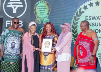 A proud business owner accepts their award at the 2024 Made in Eswatini Consumer Choice Awards