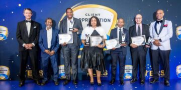 Eswatini Revenue Service Tax Commissioner and Minister of Finance, Neal Rijkenberg, pose with award recipients during the 2024 Client Appreciation Day group photo.