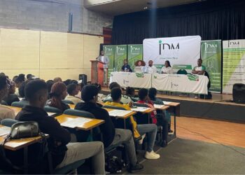 IDM scholarship candidates engage in an information session with officials