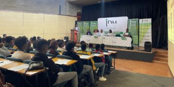 IDM scholarship candidates engage in an information session with officials