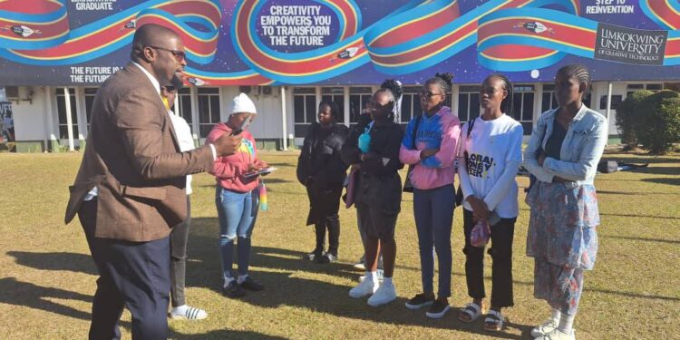 Enactus Eswatini Country Leader Sabelo Dlamini engaging with the Limkokwing University team during a visit to view their Re-Tile plastic waste innovation project. Photo by Enactus Eswatini