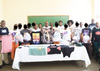 Inmates at Bhalekane Correctional Centre pose with members of the Beyond Success team after receiving 500 donated T-shirts, part of a rehabilitation initiative aimed at restoring dignity and promoting hope among those in custody.