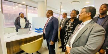 Minister of Commerce, Industry and Trade Manqoba Khumalo tours the BOSS centre in Mbabane as officials from EIPA