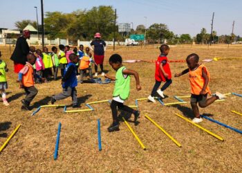 Young athletes enjoy a fun relay race during the Kids Athletics event at Olympafrica Centre in Lobamba. Photo by AE