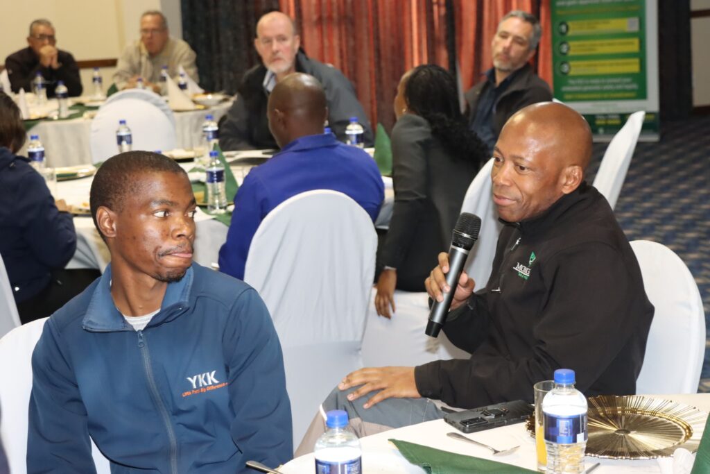 A representative from the private sector shares feedback during the EEC Customer Breakfast Meeting held in Manzini.