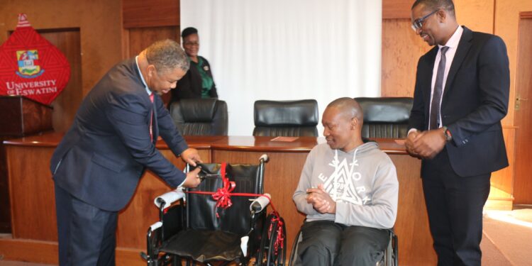 Ndumiso Bhembe beams with gratitude after receiving a new wheelchair, presented by Reverend Dr. Chong-Yang Kim at UNESWA, with support from Care for Someone Eswatini, the Student Counselling Office, and SRC.